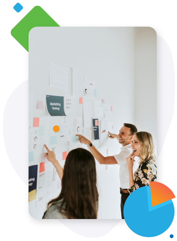 Team members brainstorming ideas on a wall